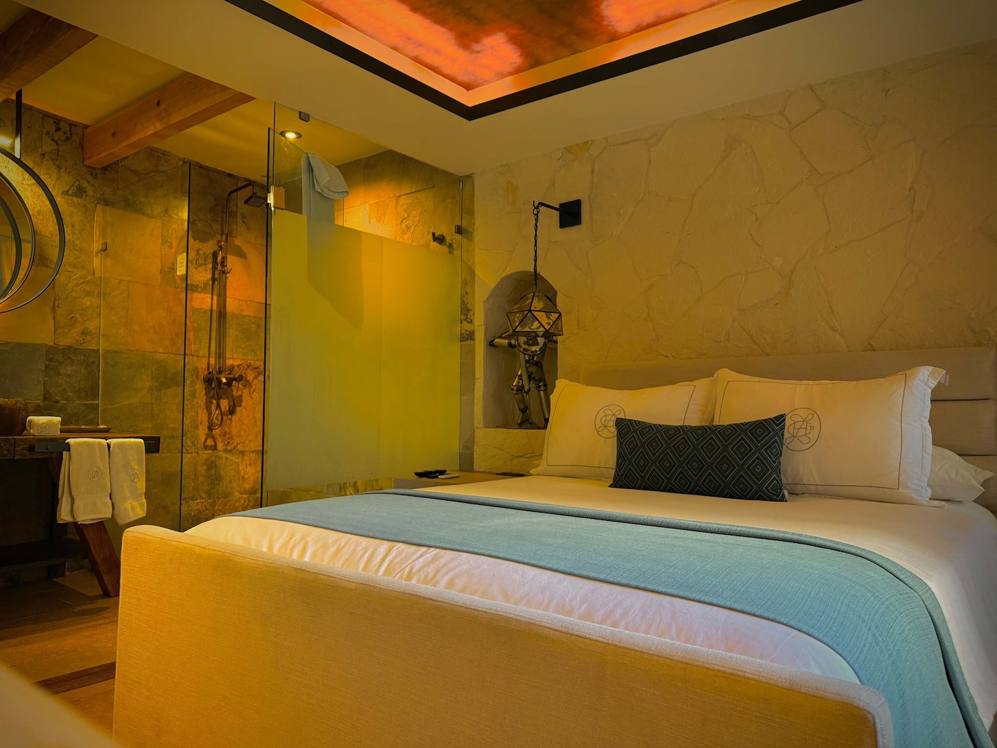 Hojalata king suite with dramatic ambient lighting and an open spa-inspired bathroom
