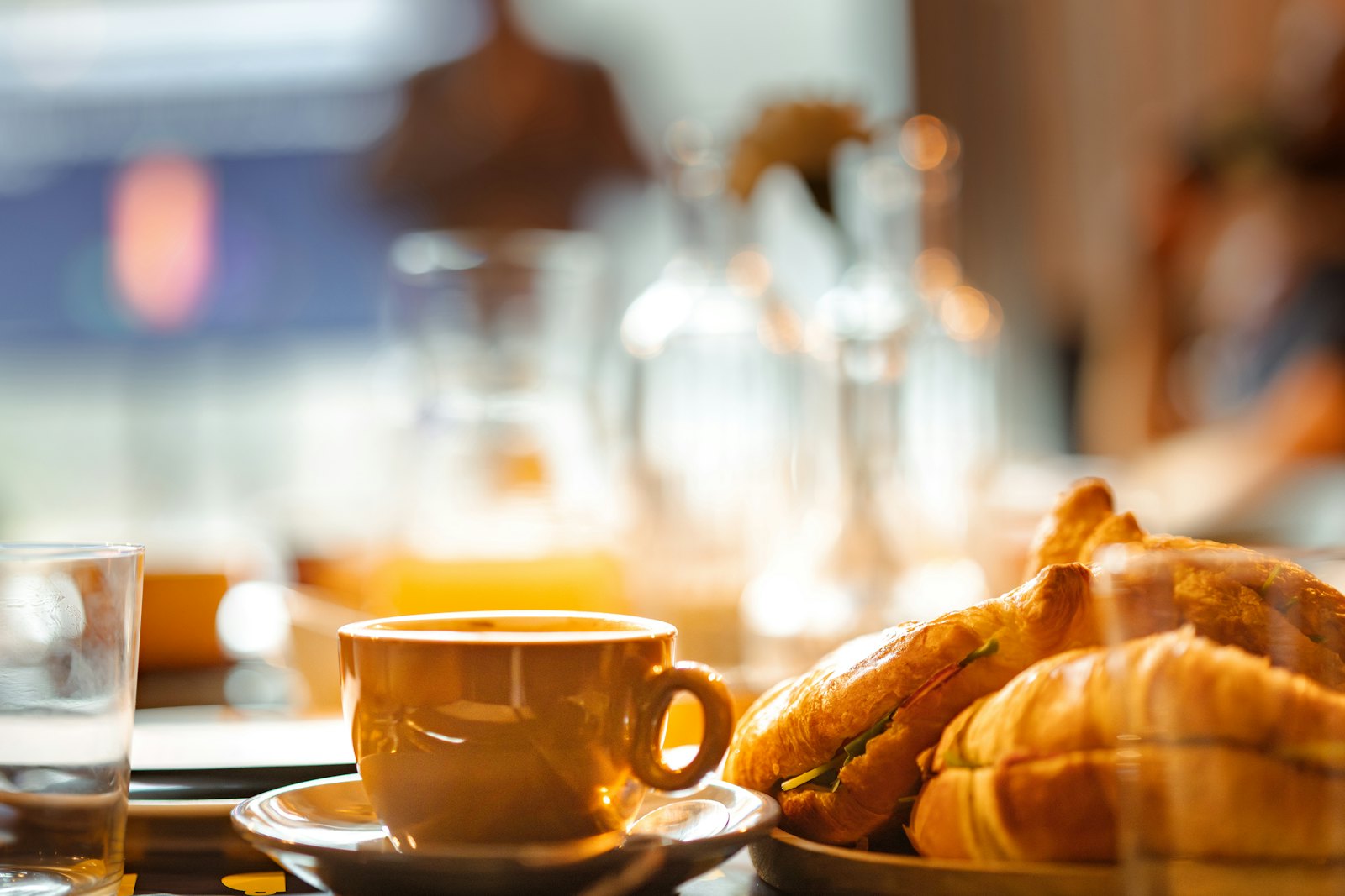 Continental breakfast at Casa Laja: fresh croissants and coffee in golden morning light