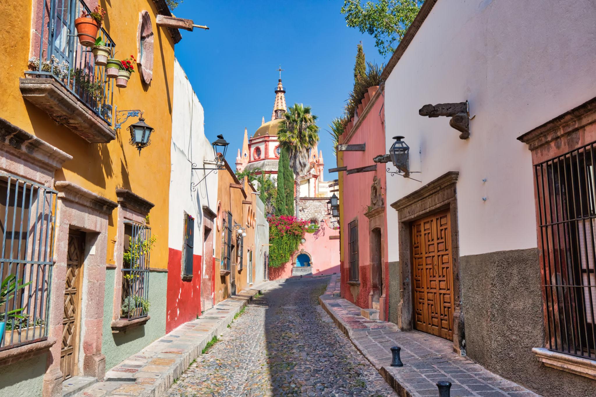 Colorful colonial façades along a cobblestone street